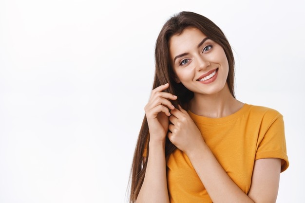 close up tender feminine alluring girlfriend taking care her hair touching strands tilt head smiling satisfied with good haircare product she applied make hairstyle white background 176420 36997